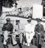 General Douglas A. MacArthur, President Franklin D. Roosevelt, Admiral Chester W. Nimitz, and Admiral William D. Leahy (FDR"s chief of Staff), aboard USS Baltimore (CA 68) in Pearl Harbor