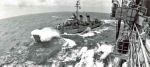 Alongside USS Hancock (CVA 19):  Personnel transfer at sea to Tingey (DD 539) via boatswain's chair