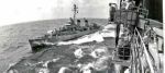 Alongside USS Hancock (CVA 19):  Personnel transfer at sea to Tingey (DD 539) via boatswain's chair