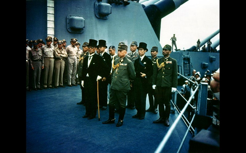 Japanese delegation stands before the Allies on the Missouri's 'veranda deck.