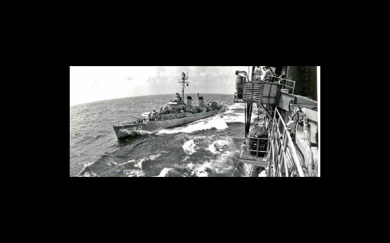 Alongside USS Hancock (CVA 19): Personnel transfer at sea to Tingey (DD 539) via boatswain's chair